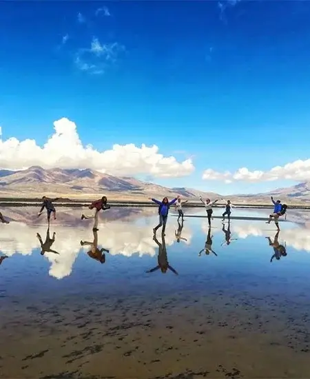 Tourists enjoying the scenic landscapes of Aguada Blanca National Reserve in Peru | Andean Travel Experience