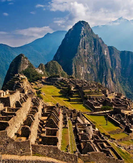 Panoramic view of Machu Picchu, the ancient Inca citadel nestled in the Andes Mountains of Peru | Andean Travel Experience