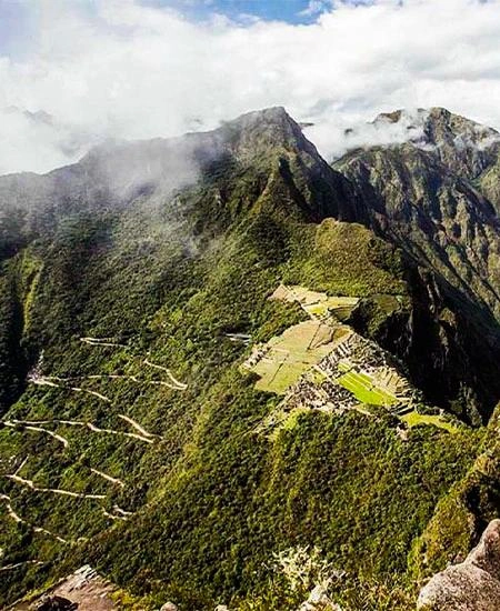 Aerial view of Machu Picchu from Huayna Picchu, showing the ancient Inca citadel | Andean Travel Experience