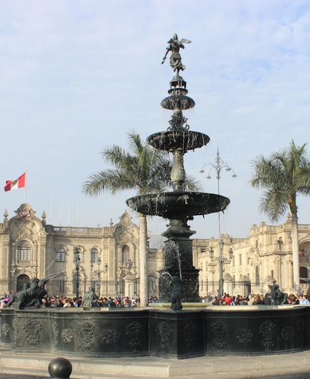 The central fountain in the Plaza de Armas of Lima, surrounded by historic buildings | Andean Travel Experience