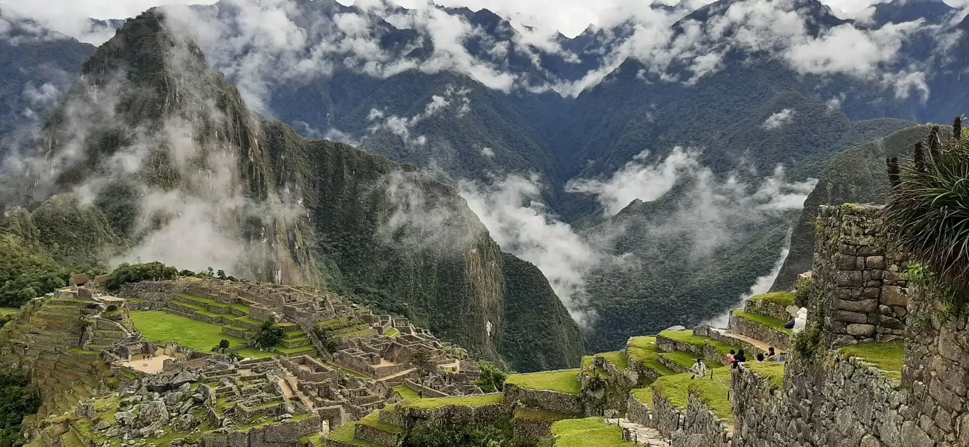 Huayna Picchu and Machu Picchu cloudy day | Andean Travel Experience
