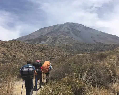 Hikers ascending Misti Volcano in Arequipa, Peru, with panoramic views of the surrounding landscape | Andean Travel Experience