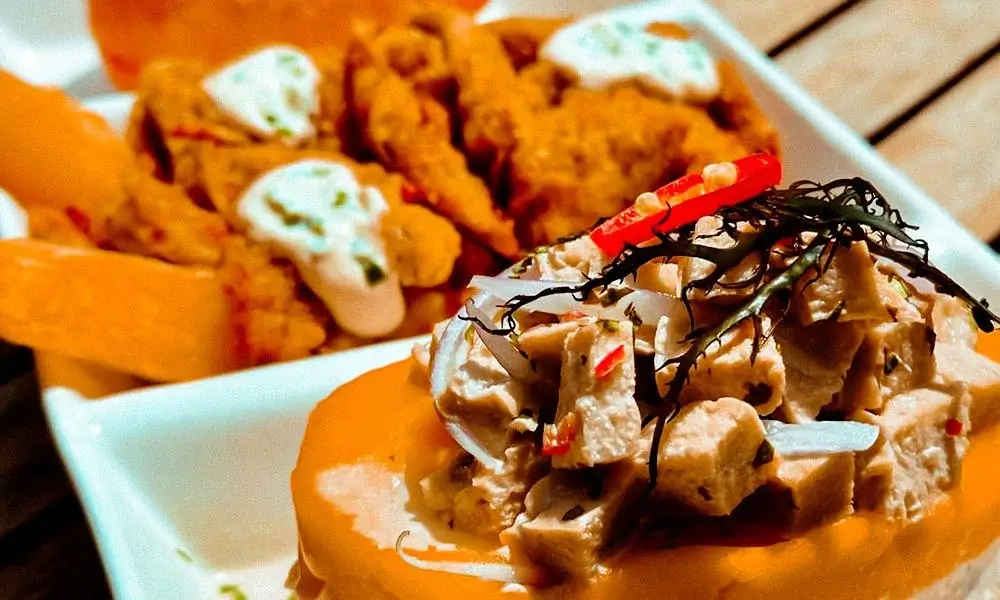 Plant-based vegan and vegetarian meals served on a table with fresh herbs and natural ingredients | Andean Travel Experience Plant-based vegan and vegetarian meals served on a table with fresh herbs and natural ingredients | Andean Travel Experience