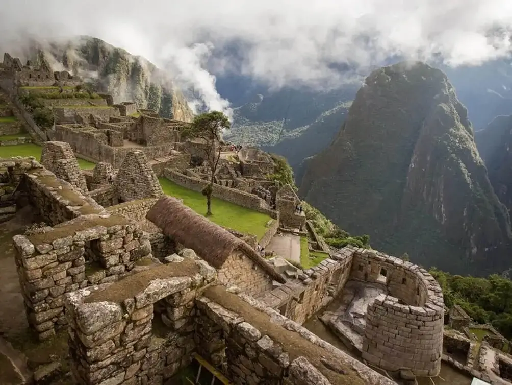Temple of the sun Close-up of Inca stone walls in Machu Picchu showing precision craftsmanship | Andean Travel Experience