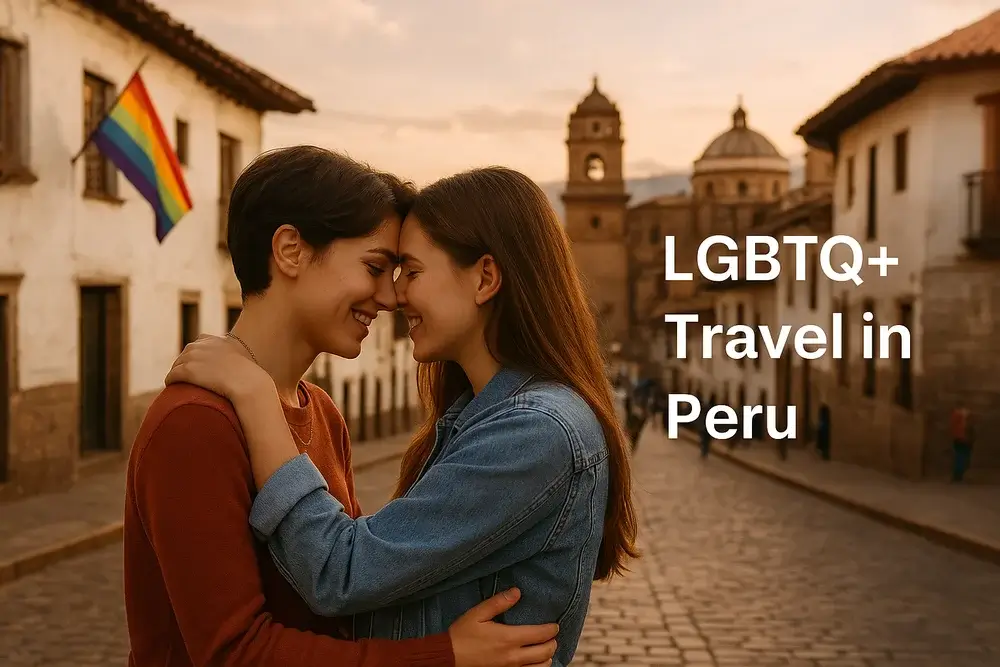 Two young women embrace affectionately on a cobblestone street in Cusco during golden hour, with the iconic Cusco Cathedral and a rainbow flag in the background. The image highlights LGBTQ+ travel in Peru, capturing love, inclusivity, and the city’s colonial charm. | Andean Travel Experience Two young women embrace affectionately on a cobblestone street in Cusco during golden hour, with the iconic Cusco Cathedral and a rainbow flag in the background. The image highlights LGBTQ+ travel in Peru, capturing love, inclusivity, and the city’s colonial charm. | Andean Travel Experience