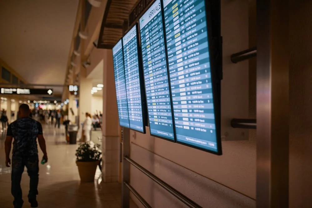close-up of airport flight information display board | Andean Travel Experience
