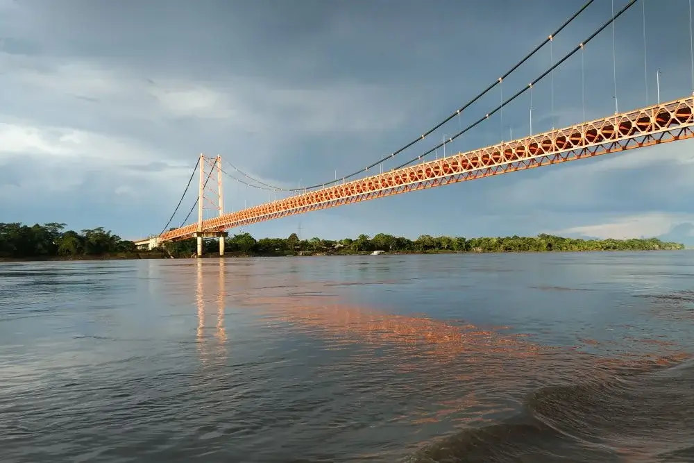 Puerto Maldonado Bridge on Peru Jungle across amazon river | Andean Travel Experience Puerto Maldonado Bridge on Peru Jungle across amazon river | Andean Travel Experience