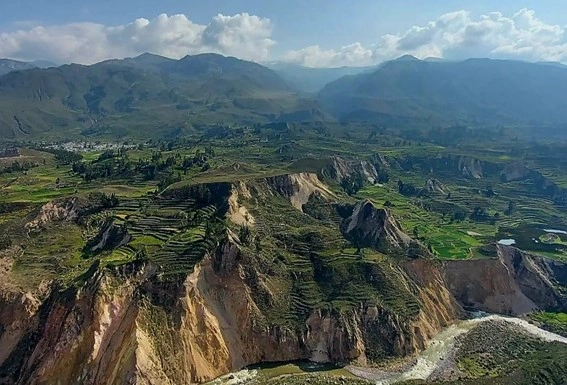 Breathtaking view of Colca Canyon in Peru, showcasing its scenic landscapes | Andean Travel Experience