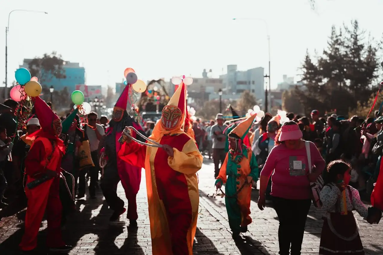 Children in colorful costumes parading and collecting candies during a festive celebration | Andean Travel Experience