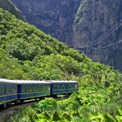 Luxury train traveling to Machu Picchu, offering scenic views of the Peruvian landscape | Andean Travel Experience