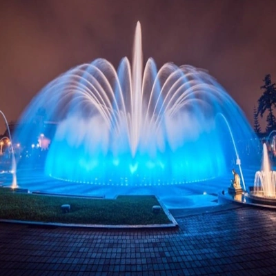 Night view of the Magic Water Circuit in Lima, Peru, with illuminated fountains creating a colorful water show | Andean Travel Experience