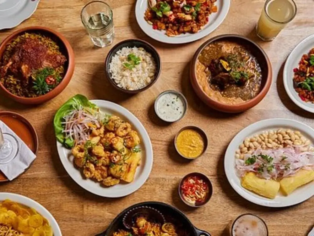 Traditional Amazonian dish featuring majaz (wild peccary meat) grilled and served with rice, plantains, and regional herbs from the Peruvian jungle. | Andean Travel Experience