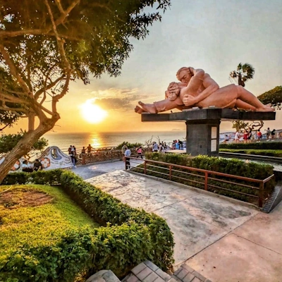 Views of the Parque del Amor in Miraflores, Lima, featuring sculptures and ocean backdrop | Andean Travel Experience.