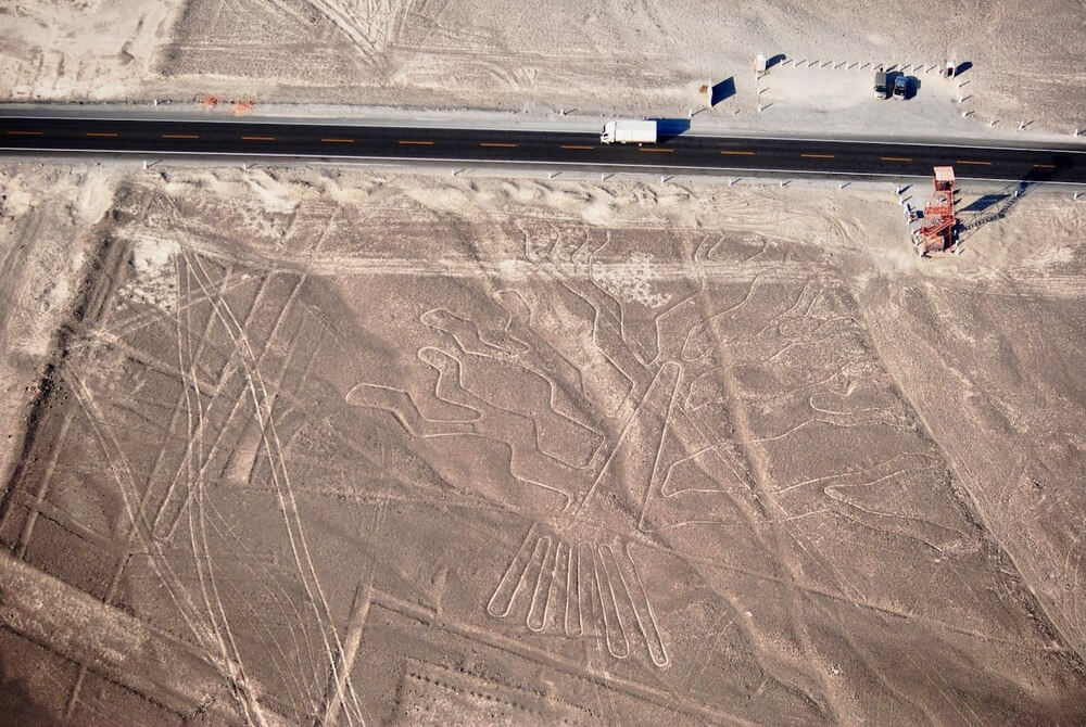 Aerial view of the Nazca Lines in Peru showing intricate geoglyphs in the desert | Andean Travel Experience