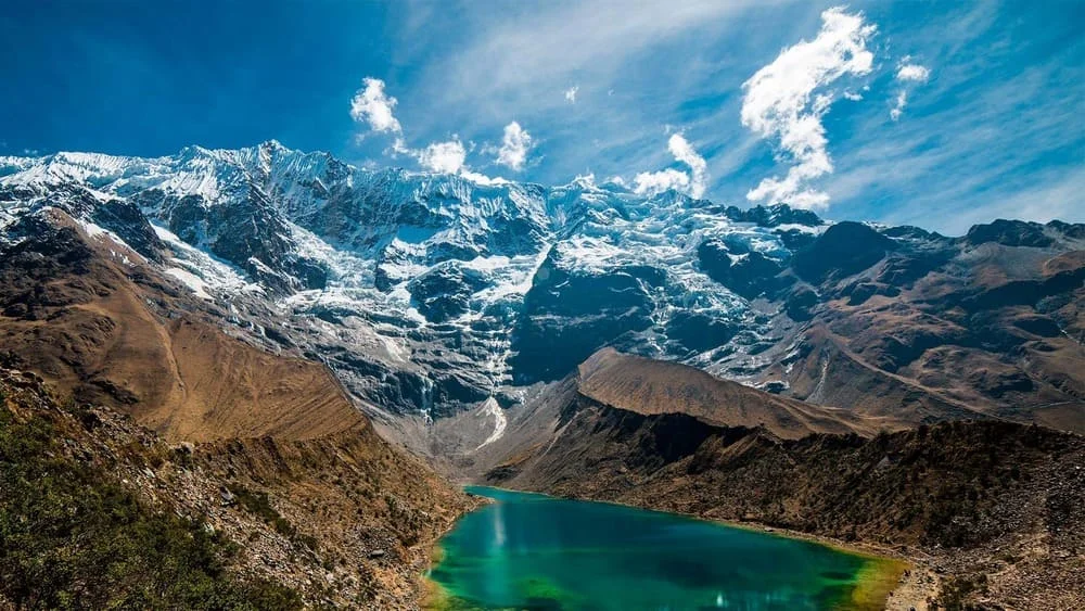 Snow-capped peaks of Ausangate mountain in Cusco glowing at sunrise, Peru. | Andean Travel Experience