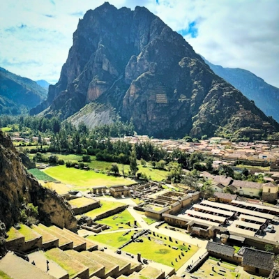 Ruins of the Temple of the Sun in Ollantaytambo, featuring stone walls and ceremonial platforms | Andean Travel Experience