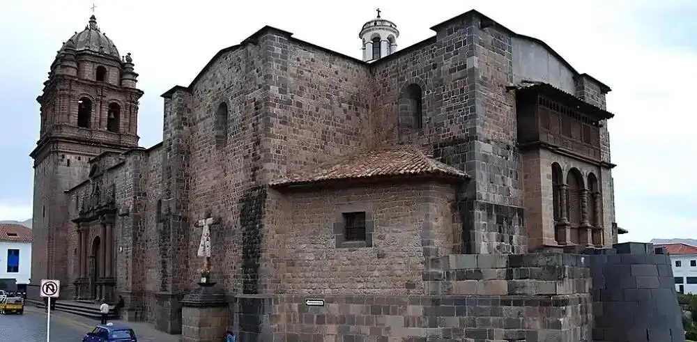 Back view of Qoricancha in Cusco with original Inca stonework and colonial architecture | Andean Travel Experience