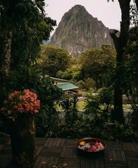 Sanctuary Lodge, the only hotel located adjacent to Machu Picchu, offering luxurious accommodations with stunning views of the Inca ruins| Andean Travel Experience