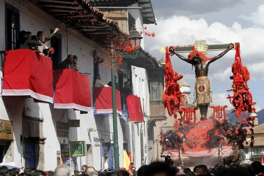 Easter procession in Cusco, Peru, featuring a statue of Christ on the cross carried through the streets by devotees. | Andean Travel Experience Easter procession in Cusco, Peru, featuring a statue of Christ on the cross carried through the streets by devotees. | Andean Travel Experience