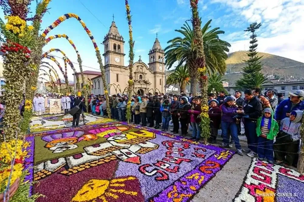 Colorful sawdust carpets in Huancayo, Peru, created for Easter celebrations, depicting religious and floral designs along the streets. | Andean Travel Experience Colorful sawdust carpets in Huancayo, Peru, created for Easter celebrations, depicting religious and floral designs along the streets. | Andean Travel Experience