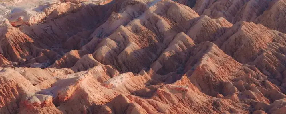 Aerial view of majestic Andean mountains under a clear sky | Andean Travel Experience