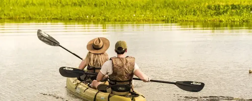 Kayaking on the Amazon River surrounded by rainforest | Andean Travel Experience