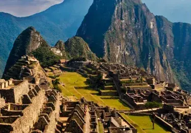 Panoramic view of the ancient Inca ruins of Machu Picchu, nestled in the Peruvian Andes | Andean Travel Experience