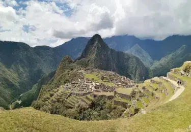 Panoramic view of the ancient Inca ruins of Machu Picchu, nestled in the Peruvian Andes | Andean Travel Experience