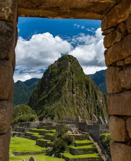 The ancient Inca ruins of Machu Picchu, nestled in the Andes Mountains | Andean Travel Experience