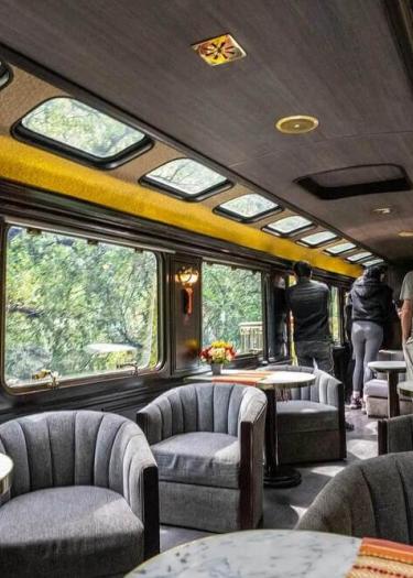 Panoramic view from inside the Vistadome train showing large windows during the journey | Andean Travel Experience