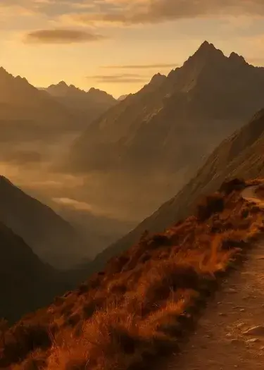 Panoramic view of the Andes in Peru at golden hour, featuring a winding mountain trail, misty valleys, and dramatic sunlit peaks in a luxury travel editorial style. | Andean Travel Experience