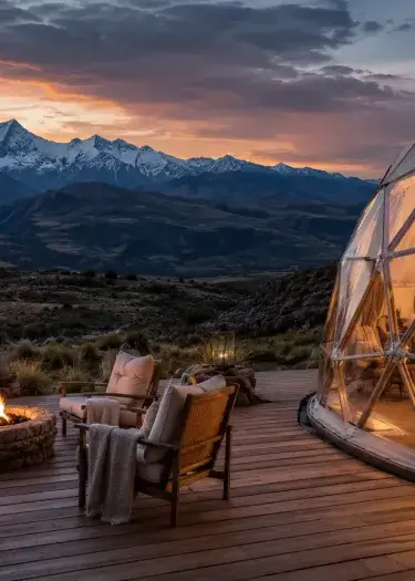 Luxury glamping in Peru with a geodesic dome, private fire pit, and panoramic views of the Andean mountains at sunset. | Andean Travel Experience