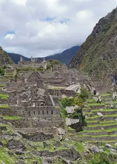 Machu Picchu Inca Ruins Rocks Stairs Green scenary | Andean Travel Experience