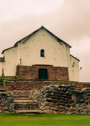 House of Chincheros in Cusco Peru Cloudy day inca rocks | Andean Travel Experience