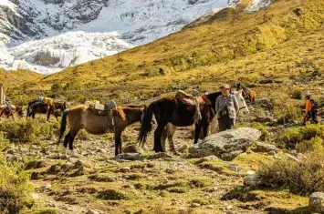 Female traveler admiring the inca trail route | Andean Travel Experience