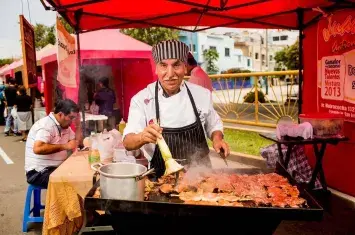 Street food carts and carretilleros serving traditional dishes at Mistura | Andean Travel Experience