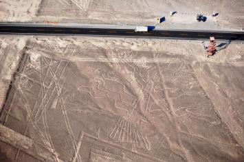 Scenic flight over the Nazca Lines, showing geometric and animal designs in the desert | Andean Travel Experience