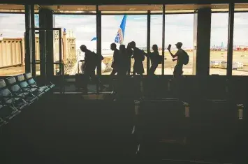 Airport departure hall with travelers | Andean Travel Experience