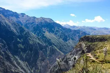 Wide-angle view of Colca Canyon, one of the deepest canyons in the world, surrounded by rugged Andean mountains | Andean Travel Experience