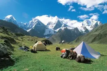 Sunset over Laguna Jahuacocha campsite with snow-covered peaks in the Cordillera Huayhuash | Andean Travel Experience