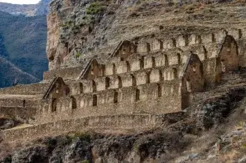 Pinkuylluna Inca storehouses overlooking Ollantaytambo in the Sacred Valley | Andean Travel Experience