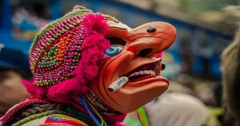 Man in traditional costume at Virgen del Carmen festival | Andean Travel Experience