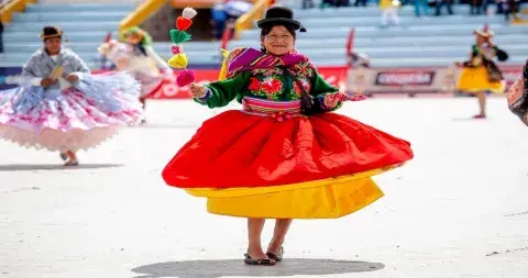 Woman dancing in the Virgen de la Candelaria festival in Puno | Andean Travel Experience