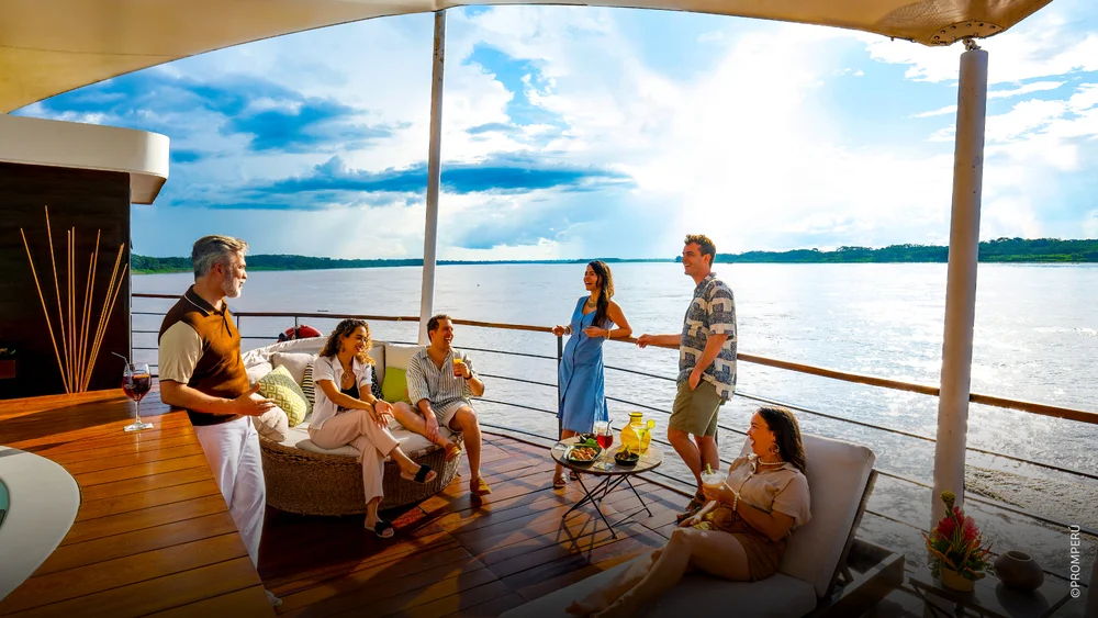 Outdoor observation deck on a luxury Amazon river cruise ship surrounded by the Peruvian rainforest | Andean Travel Experience Outdoor observation deck on a luxury Amazon river cruise ship surrounded by the Peruvian rainforest | Andean Travel Experience
