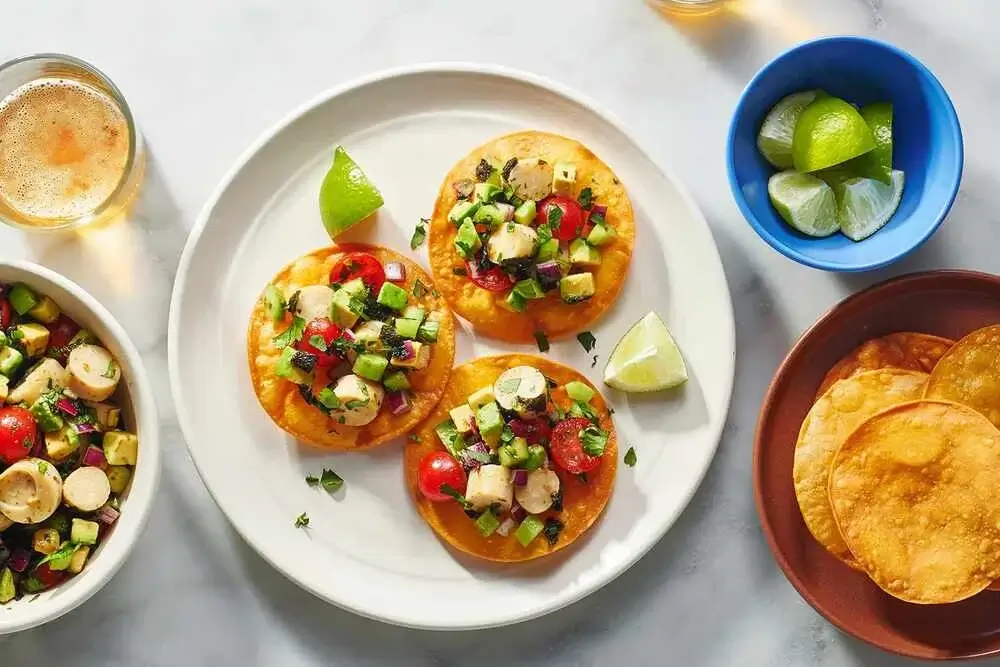 Plant-based vegan and vegetarian Peruvian meals served on a table with fresh herbs and natural ingredients | Andean Travel Experience Plant-based vegan and vegetarian Peruvian meals served on a table with fresh herbs and natural ingredients | Andean Travel Experience