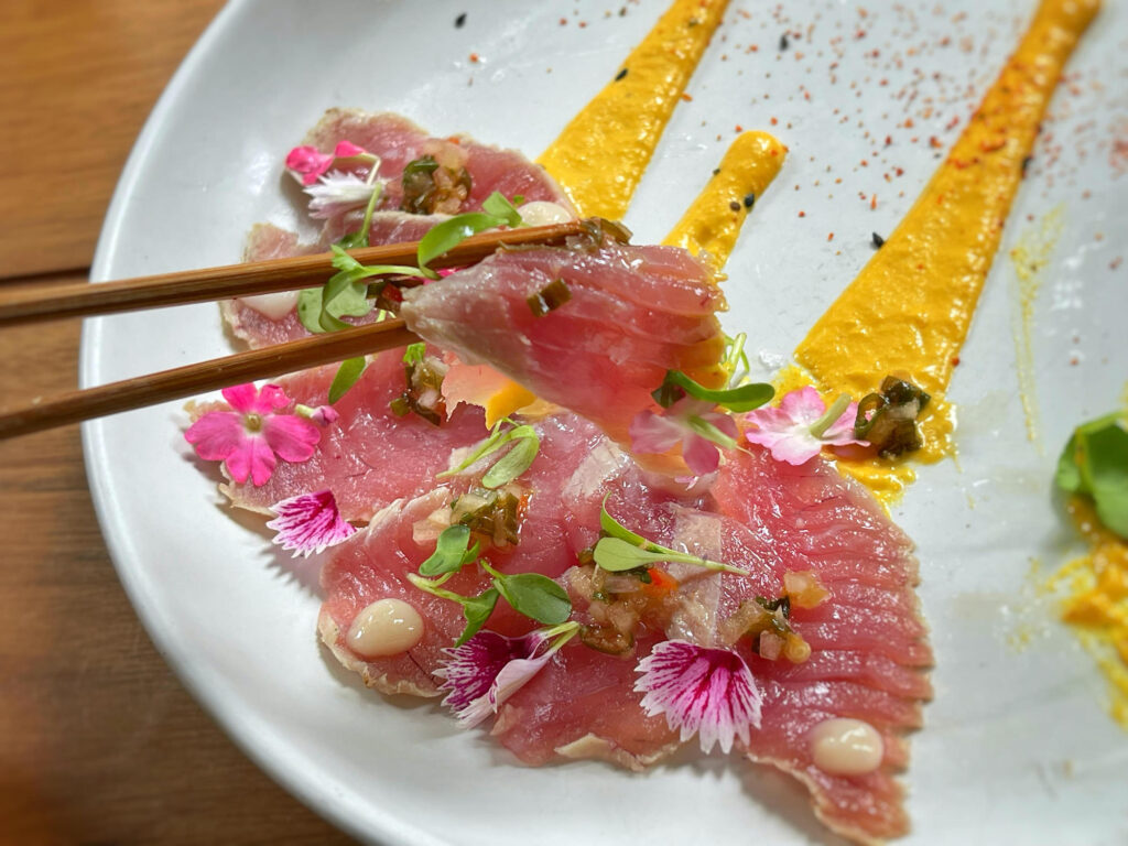 Tuna Tataki: Aji amarillo sauce, Nippon chimichurri, chirimoya gel, cilantro. By Highly Explorable